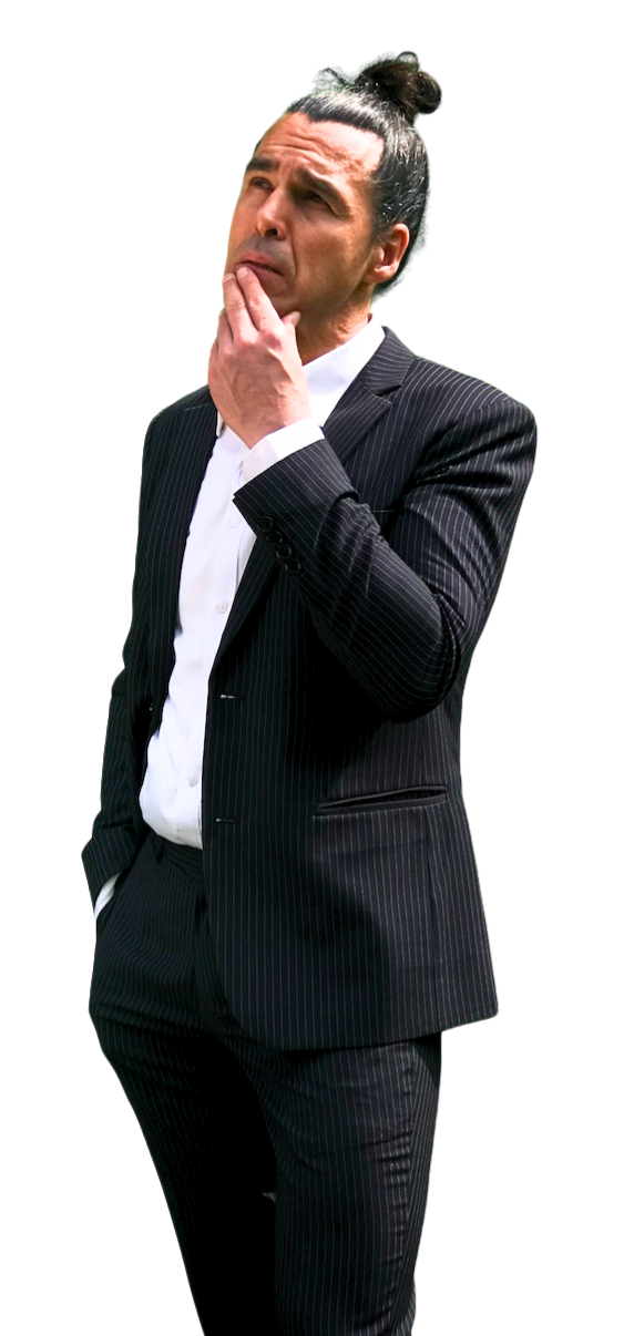 a photo of Davido, the English teacher dressed in a dark pin-striped suit and a white shirt. His hair is done up in a tight coil on the top of his head. He's holding his jacket with the right hand whilst he's smiling and looking to the right, to the area of content.