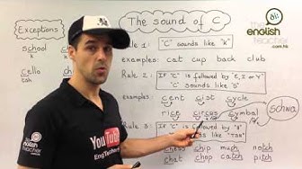 An English class in Hong Kong on the sound of C by a teacher with a cap in front of a whiteboard